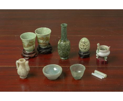 A GROUP OF ASSORTED JADE OBJECTS Including a miniature tripod censer, two cups with gilt landscape decoration, a bottle vase 