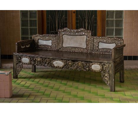 A MARBLE INSET AND MOTHER OF PEARL INLAID HARDWOOD BENCH
With inlaid foliate decoration, pierced and carved apron, on reeded 