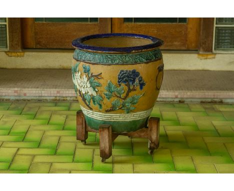 A GLAZED POTTERY PLANTER
Decorated with a phoenix and peonies
42cm high
Condition: For a condition report or further images, 