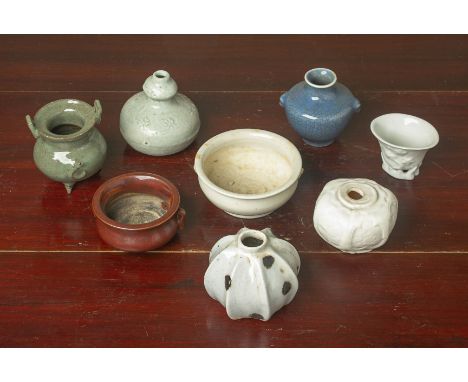 A GROUP OF SMALL CHINESE CERAMICS Of various styles, including blanc de chine, a fluted water pot, three sensors, and a crack