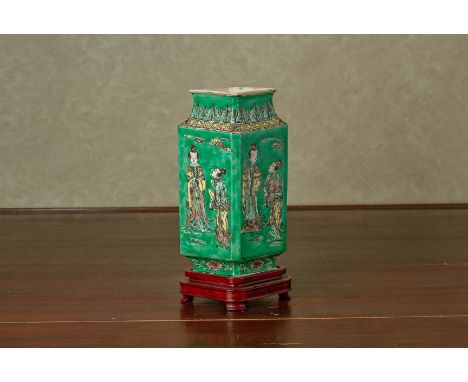 A FAMILLE VERTE LOZENGE SHAPED VASE
Of Kangxi style, the sides decorated with figures between foliate borders
24cm high
Condi