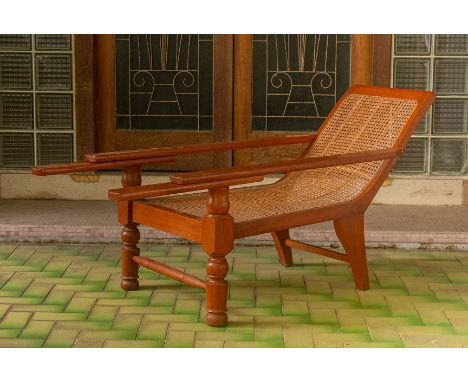A PLANTER STYLE RECLINING ARMCHAIR
With caned seats and swing out arms
75cm H x 61cm x 127cm D
Condition: For a condition rep