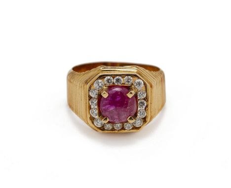 A RUBY CABOCHON RING The central ruby cabochon, approximately 1 carat, claw set within a paste surround, the gold setting unm