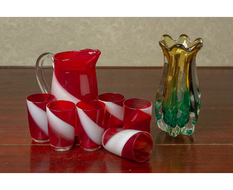 A VINTAGE CRANBERRY AND OPAQUE GLASS DRINKS SET
With six glasses and pitcher, together with a sculptural studio art glass vas