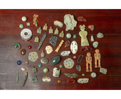A LARGE ASSORTED GROUP OF JADE AND HARDSTONE CARVINGS
Including figures, pierced disks, animals, rings, swords, spheres etc.
