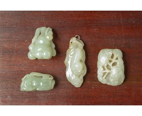 A GROUP OF FOUR JADE CARVINGS
Including one of double gourds, another of an animal resting on a leaf
Largest 8cm long
Conditi