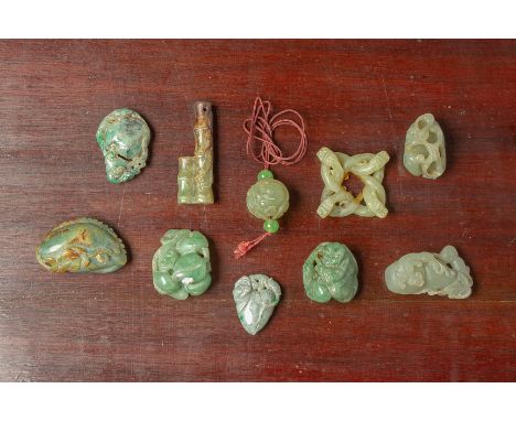 A GROUP OF TEN ASSORTED JADE CARVINGS
Including figures holding lotus, a double gourd, a stylised fish, bamboo and intertwine