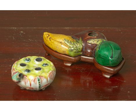 TWO CERAMIC WATER DROPPERS
One modelled as fruit on hardwood stand, the other modelled as a lotus flower
Largest 14cm wide
Co