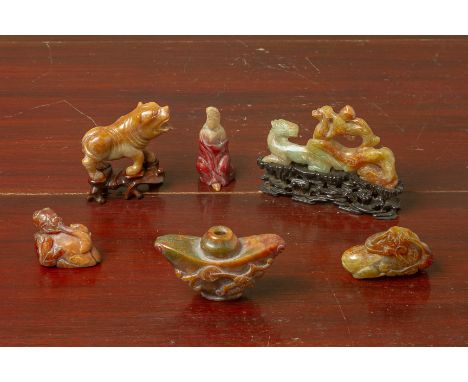 A GROUP OF RUSSET JADE CARVINGS
Including one of a horse on stand, a recumbent mythical beast, group of fruiting foliage etc 