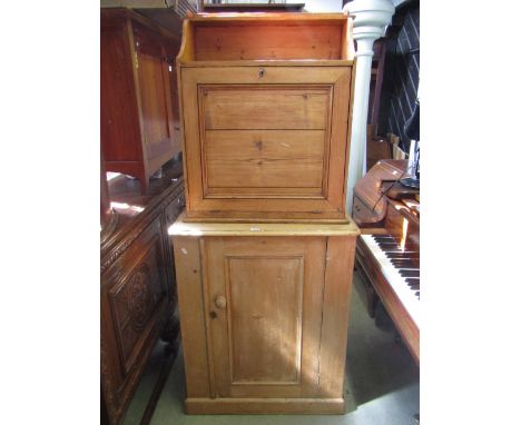 A vintage stripped pine side cupboard, floorstanding and enclosed by a rectangular moulded panelled door, together with a fur