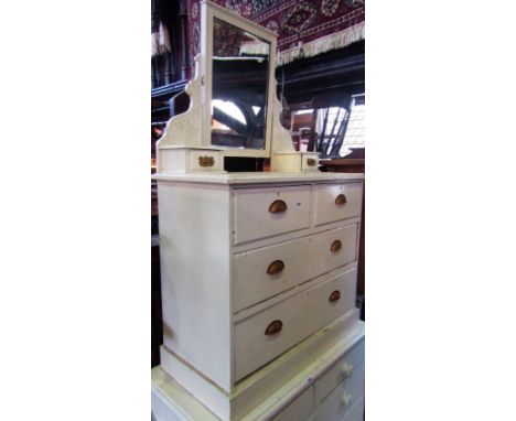 An Edwardian pine dressing chest of two long and two short drawers with raised rectangular swing mirror over, flanked by shap