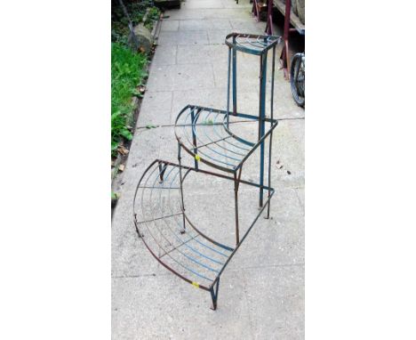 A weathered green painted light steel corner planter on three graduated stepped tiers, together with a pair of further open b