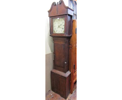 An early 19th century oak longcase clock, the square painted dial enclosing a 30 hour movement by E Matthews Junior of Welshp