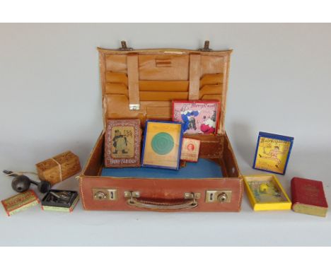 Leather suitcase containing various vintage games