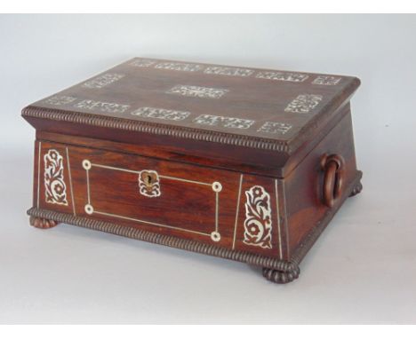 19th century rosewood and mother-of-pearl inlaid sarcophagus work box, the hinged lid enclosing a fitted interior with twin r