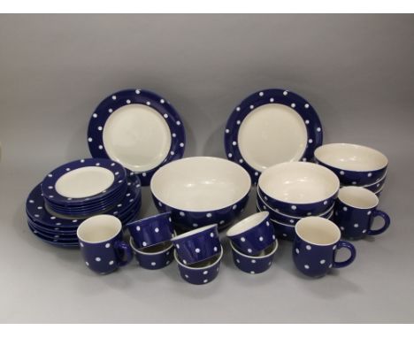 A Spode 'Baking Days' part tea and dinner service with blue polka dot decoration comprising various bowls, plates, cups, etc 