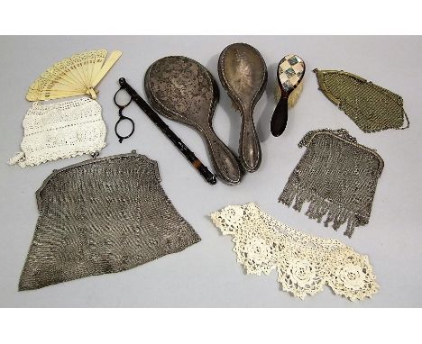 A mixed lot to include a silver dressing brush and mirror, two white metal mesh purses, a further metal mesh purse, a mother 