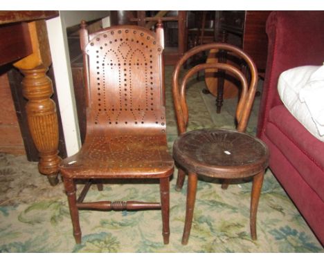 A Victorian child's chair with turned frame and decorative pierced laminated ply wood seat and combined back together with a 