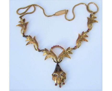 A vintage 18ct pink spinel necklace with articulated drop and foliate links, 18.6g