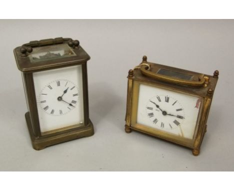 A vintage brass cased carriage time piece by Bull of Bradford, 9cm high; together with a further brass carriage time piece (2