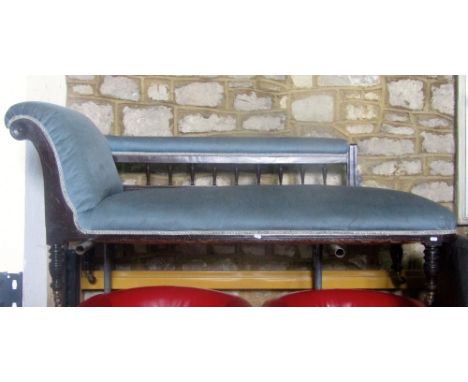 An Edwardian chaise longue with powder blue dralon upholstered seat, scrolled head rest and seat rail, showwood supports with