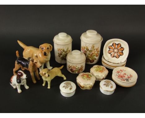 A Beswick model of an Airedale terrier together with an Alton china model of a spaniel, two further ceramic models of yellow 