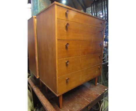 A pair of 1970s Avalon teak veneered bedroom chests of five long graduated drawers raised on tapered legs, together with a vi