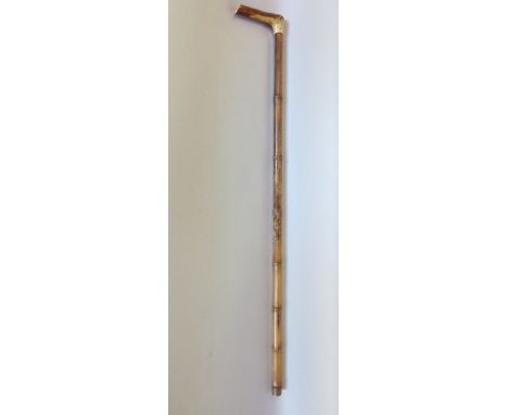 A bamboo shafted horn handled horse measuring stick