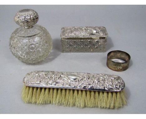 A mixed dressing lot to include a fancy silver topped cut glass jar together with a silver topped glass decanter and a silver