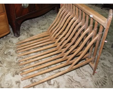 A vintage beechwood textile rack with chamfered frame