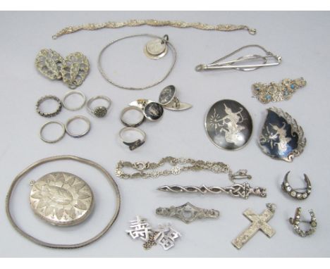 A collection of silver and white metal jewellery to include a Celtic style brooch modelled with a stags head, etc
