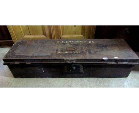 A japanned tin military officers uniform trunk of elongated rectangular form with hinged lid, side carrying handles (label to