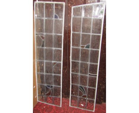 A pair of Art Deco leaded light window panels, partially coloured, each panel 100 x 30 cm approx