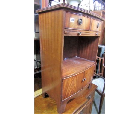 A small reproduction Georgian style mahogany veneered shallow breakfront side cupboard fitted with a T shaped arrangement of 