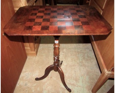 A 19th century mahogany occasional table, the rectangular top with canted corners and inlaid chequer board raised on a centra