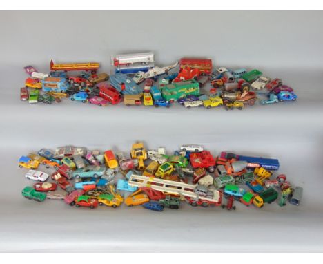 A box containing a collection of vintage die cast toys to include Corgi, Dinky and others