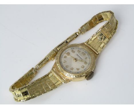 Vintage ladies Wengia wrist watch with fancy champagne dial, Arabic numerals upon a fancy 14ct chain