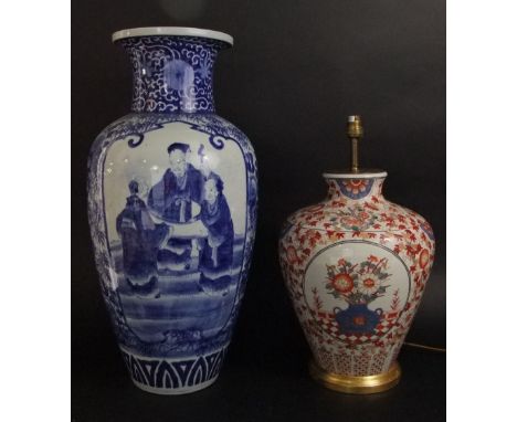 A large Chinese blue and white porcelain baluster floral vase in the Kangxi manner, decorated with panels of figures in an ex