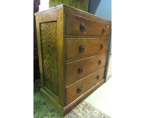 An early 20th century oak caddy top bedroom chest of four long graduated drawers set on a moulded plinth, 3ft wide approx