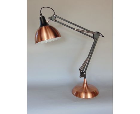 A polished copper and ebonised anglepoise type articulated desk lamp, 60cm high approx (adjustable)