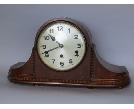 A vintage three train, oak cased Napoleon hat mantle clock, 45cm wide