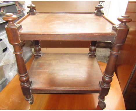 An unusual Victorian oak two tier trolley on turned supports raised on castors together with a Windsor elbow chair with elm s