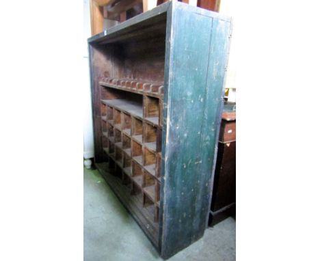 A vintage green stained/painted side cupboard with segmented shelved/pigeon holed interior, open fronted but originally enclo