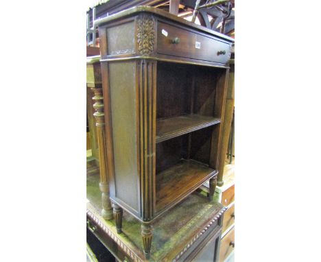 A good quality Regency style hardwood dwarf bookcase fitted with a frieze drawer over an open adjustable shelf flanked by rou