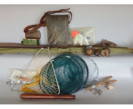 Two vintage cased fishing rods, together three antique reels, a leather fishing satchel and various tackle and an antique pol