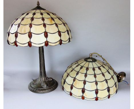 A Tiffany style leaded glass table lamp on a naturalistic cast metal column, 55cm high; together with a further Tiffany style