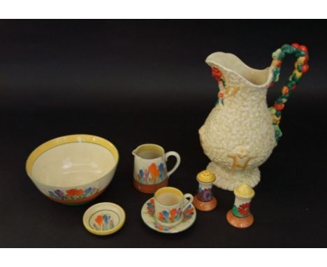 A collection of Clarice Cliff wares including a Bizarre Crocus pattern bowl, 18cm diameter approx, a pair of condiments with 