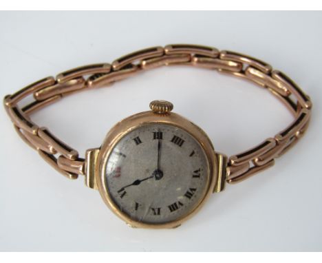 Vintage 9ct ladies wrist watch, with a silvered dial and concertina strap