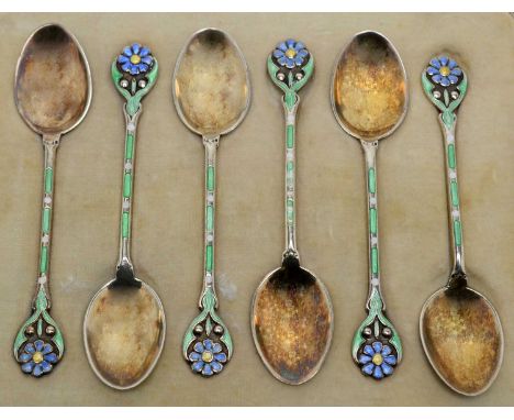 A set of six George V silver-gilt and enamel coffee spoons, by Mappin &amp; Webb, Birmingham 1913, with flower pattern finial