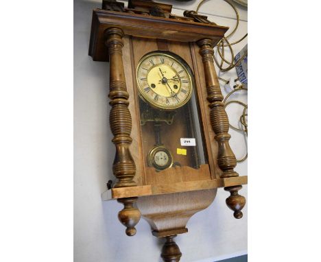 A walnut cased Vienna wall clock, the brass and enamel Roman dial signed Y&amp;N B., 80cms high.
